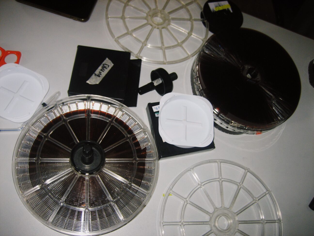 Film reels and developing equipment arranged on a table