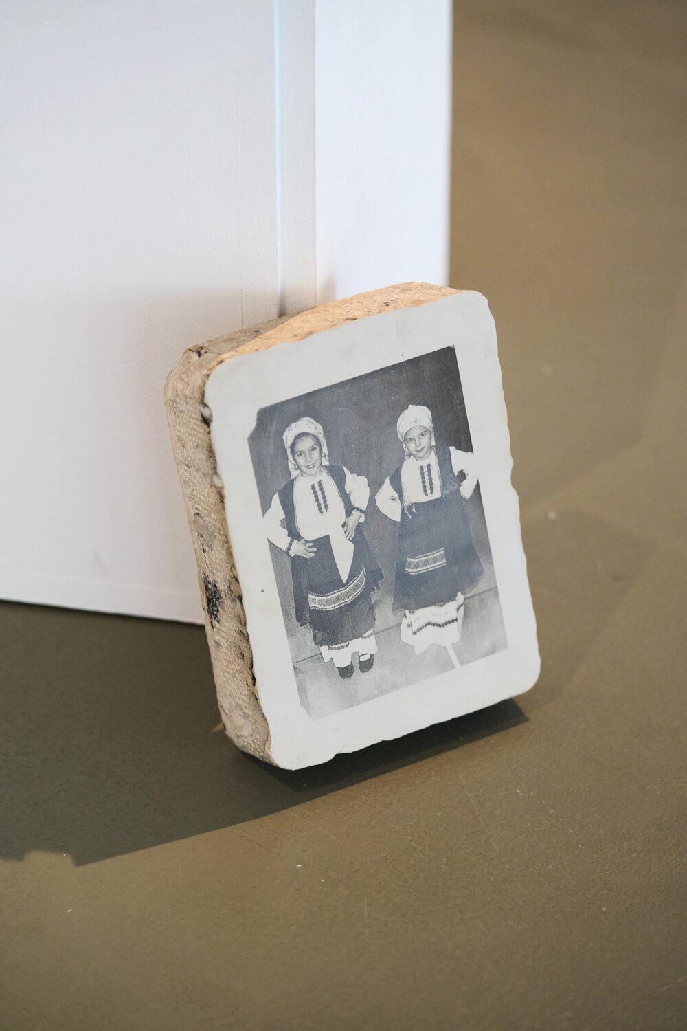 Vertical lithographic stone bearing a photograph of two children